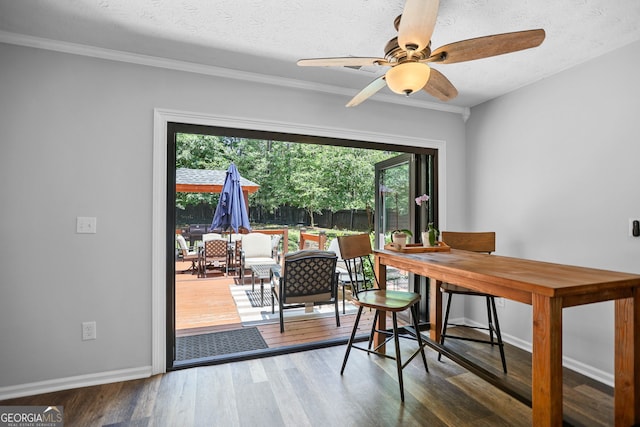 70 Otara Woods Ct, Newnan, GA 30263 - dining area with wood finished floors, a desk, a ceiling fan, ornamental molding, and baseboards