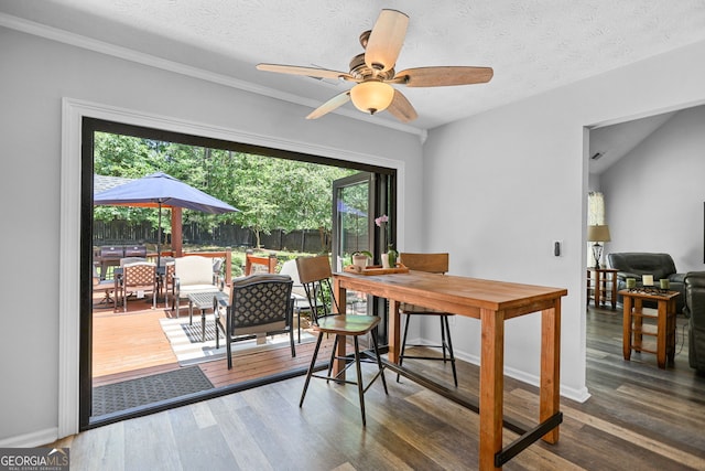 70 Otara Woods Ct, Newnan, GA 30263 - dining room featuring healthy amount of natural light, a ceiling fan, wood finished floors, baseboards, and a textured ceiling