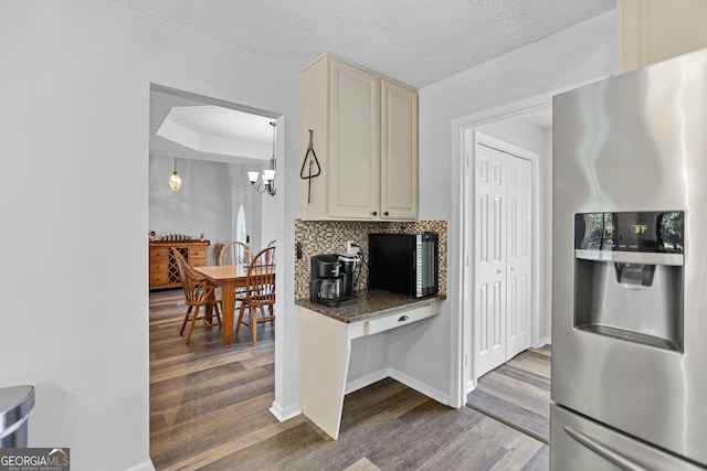 70 Otara Woods Ct, Newnan, GA 30263 - kitchen with stainless steel fridge with ice dispenser, dark wood finished floors, a chandelier, and baseboards
