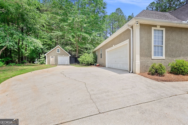 70 Otara Woods Ct, Newnan, GA 30263 - view of side of property featuring stucco siding, roof with shingles, and an outbuilding