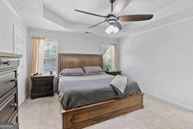 70 Otara Woods Ct, Newnan, GA 30263 - bedroom with light carpet, a textured ceiling, a tray ceiling, ornamental molding, and baseboards