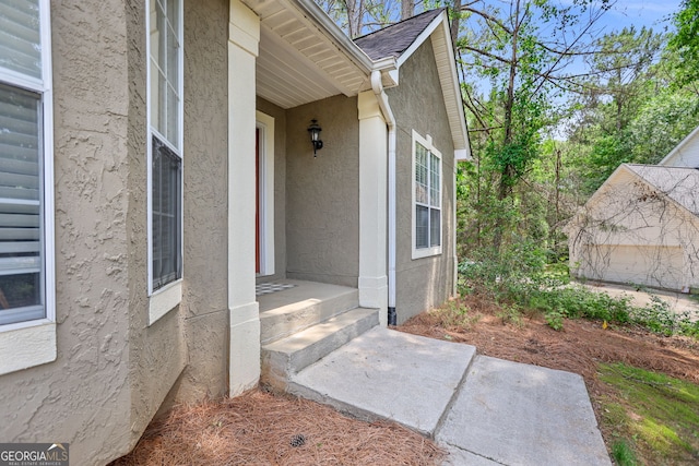 70 Otara Woods Ct, Newnan, GA 30263 - doorway to property featuring stucco siding