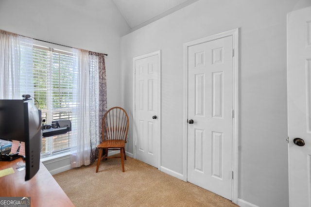 70 Otara Woods Ct, Newnan, GA 30263 - living area featuring vaulted ceiling, light carpet, a desk, and baseboards