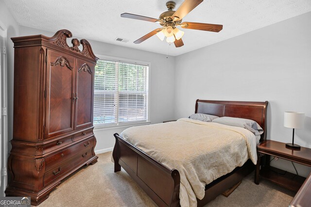 70 Otara Woods Ct, Newnan, GA 30263 - bedroom featuring light colored carpet, baseboards, and a ceiling fan