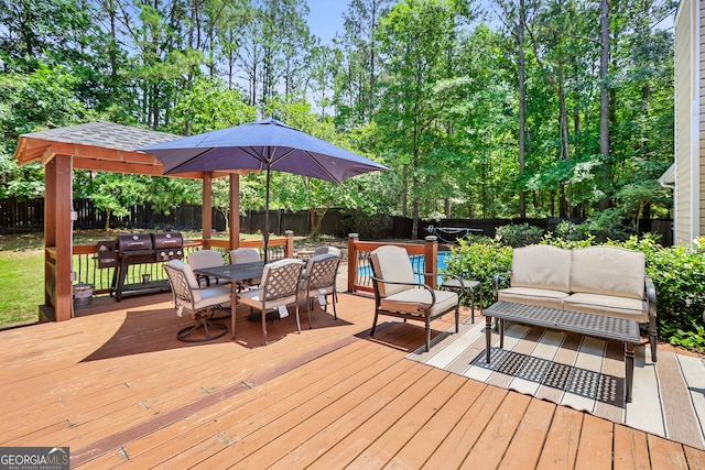70 Otara Woods Ct, Newnan, GA 30263 - wooden terrace with a fenced backyard, outdoor dining area, and an outdoor living space