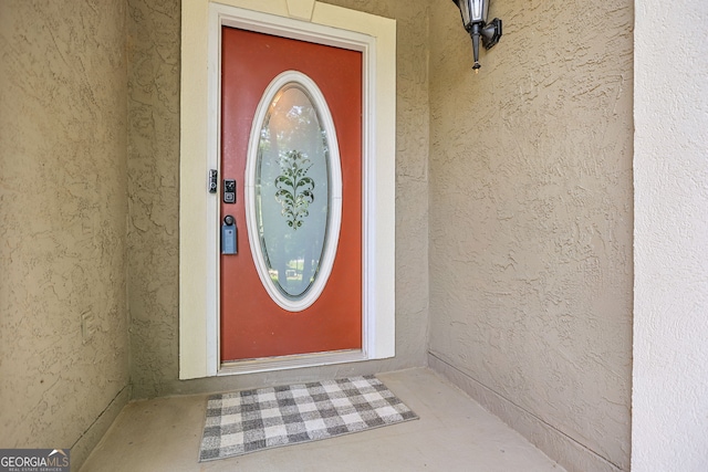 70 Otara Woods Ct, Newnan, GA 30263 - doorway to property with stucco siding