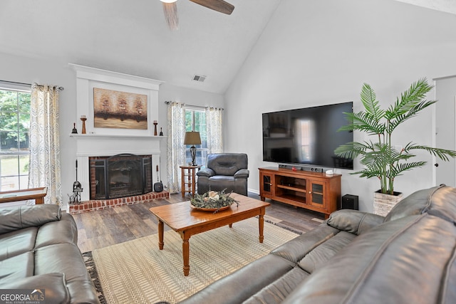 70 Otara Woods Ct, Newnan, GA 30263 - living area featuring wood finished floors, ceiling fan, a fireplace, and high vaulted ceiling