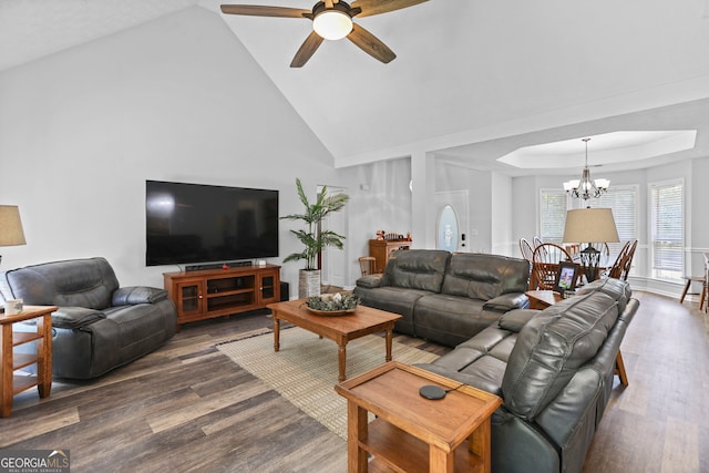 70 Otara Woods Ct, Newnan, GA 30263 - living area featuring wood finished floors, ceiling fan, a chandelier, high vaulted ceiling, and a tray ceiling
