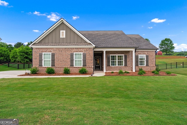 2036 Jefferson Hall Dr, Monroe, GA 30656 - craftsman house with brick siding, board and batten siding, and a shingled roof