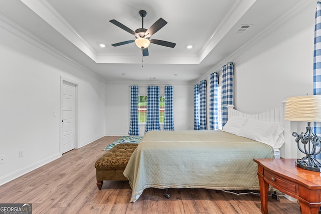 2036 Jefferson Hall Dr, Monroe, GA 30656 - bedroom with a raised ceiling, wood finished floors, crown molding, recessed lighting, and ceiling fan