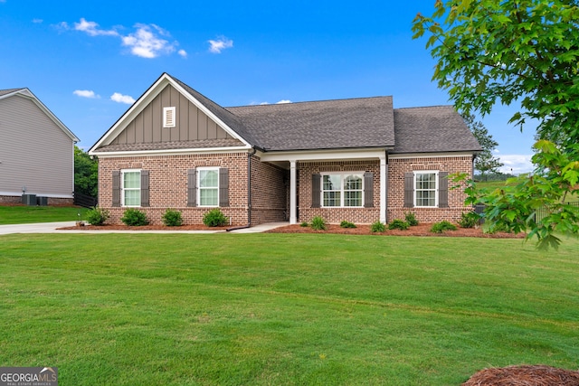 2036 Jefferson Hall Dr, Monroe, GA 30656 - craftsman-style home featuring brick siding, board and batten siding, a front yard, and a shingled roof