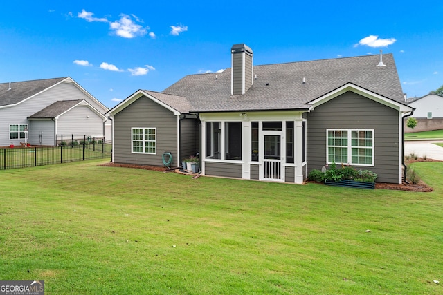 2036 Jefferson Hall Dr, Monroe, GA 30656 - back of house with a sunroom, a shingled roof, and a chimney