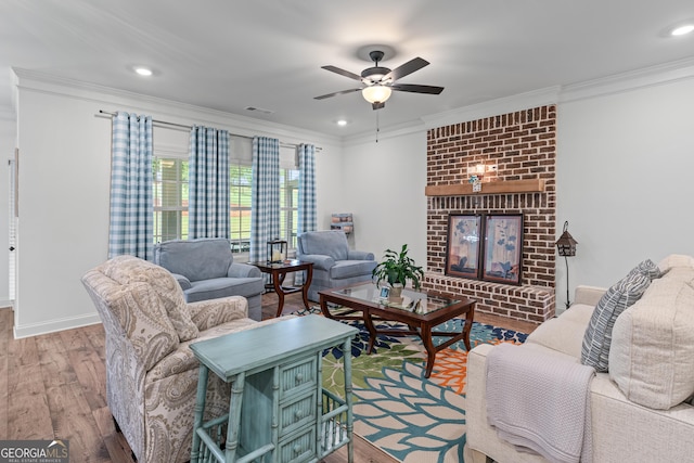 2036 Jefferson Hall Dr, Monroe, GA 30656 - living area featuring wood finished floors, ornamental molding, a ceiling fan, a fireplace, and recessed lighting