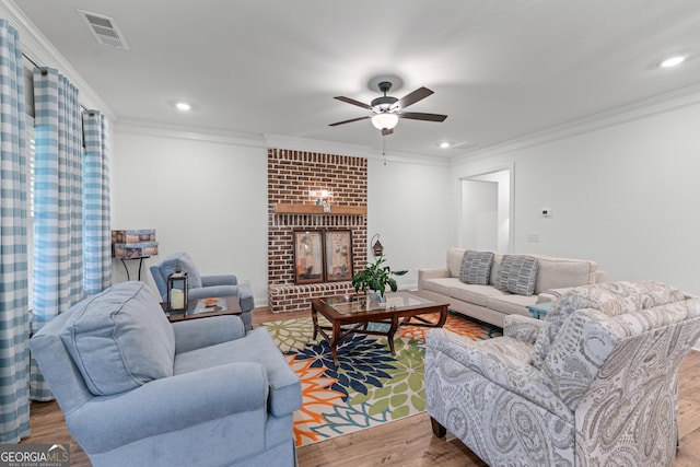 2036 Jefferson Hall Dr, Monroe, GA 30656 - living room with ornamental molding, a ceiling fan, wood finished floors, a brick fireplace, and recessed lighting