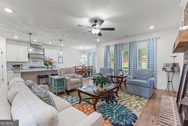2036 Jefferson Hall Dr, Monroe, GA 30656 - living area featuring recessed lighting, a ceiling fan, wood finished floors, plenty of natural light, and ornamental molding