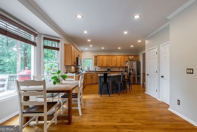405 Woodbrook Way, Lawrenceville, GA 30043 - dining room featuring ornamental molding, recessed lighting, light wood-style floors, and baseboards