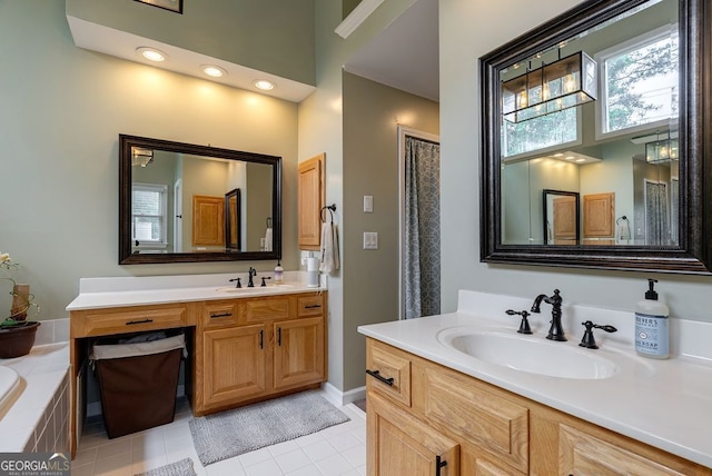 405 Woodbrook Way, Lawrenceville, GA 30043 - full bathroom featuring vanity, tiled bath, tile patterned floors, and baseboards