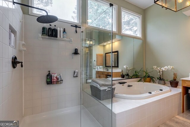 405 Woodbrook Way, Lawrenceville, GA 30043 - bathroom featuring tiled shower, vanity, and a garden tub
