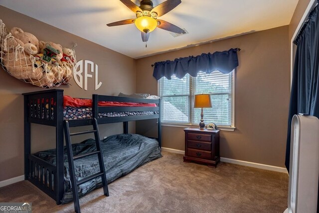 405 Woodbrook Way, Lawrenceville, GA 30043 - carpeted bedroom featuring baseboards and a ceiling fan