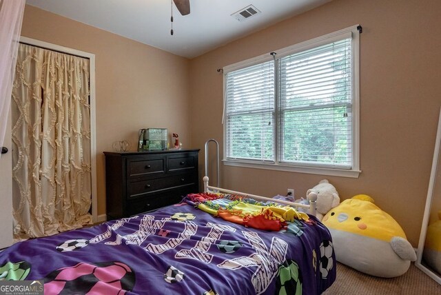 405 Woodbrook Way, Lawrenceville, GA 30043 - carpeted bedroom with multiple windows and a ceiling fan