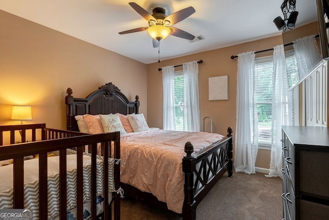 405 Woodbrook Way, Lawrenceville, GA 30043 - bedroom featuring dark carpet, baseboards, and a ceiling fan