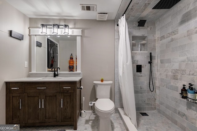 405 Woodbrook Way, Lawrenceville, GA 30043 - full bathroom featuring vanity, toilet, a tile shower, and baseboards