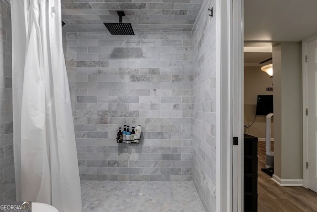 405 Woodbrook Way, Lawrenceville, GA 30043 - full bath with wood finished floors, tiled shower, and baseboards