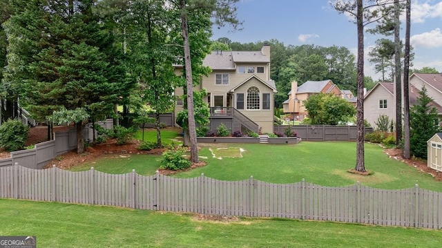 405 Woodbrook Way, Lawrenceville, GA 30043 - view of front of property with a chimney, stairway, a wooden deck, and a residential view