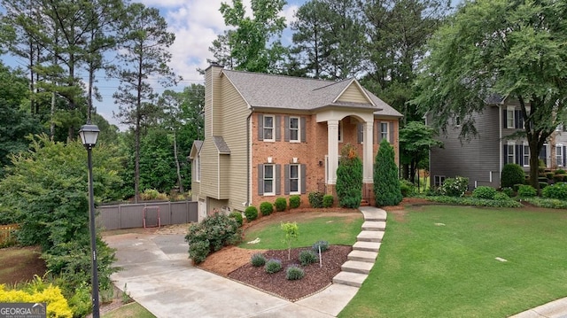 405 Woodbrook Way, Lawrenceville, GA 30043 - neoclassical / greek revival house featuring driveway, a chimney, brick siding, and a shingled roof