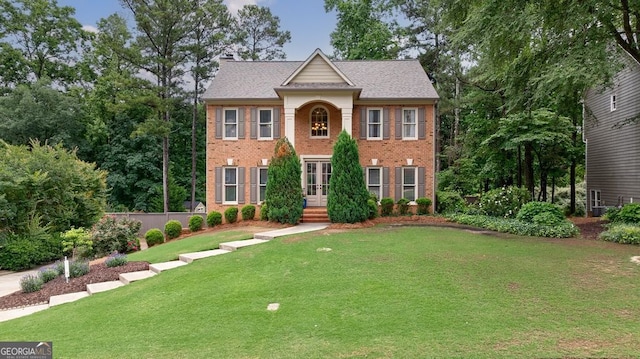405 Woodbrook Way, Lawrenceville, GA 30043 - colonial inspired home with a front lawn, brick siding, and a chimney