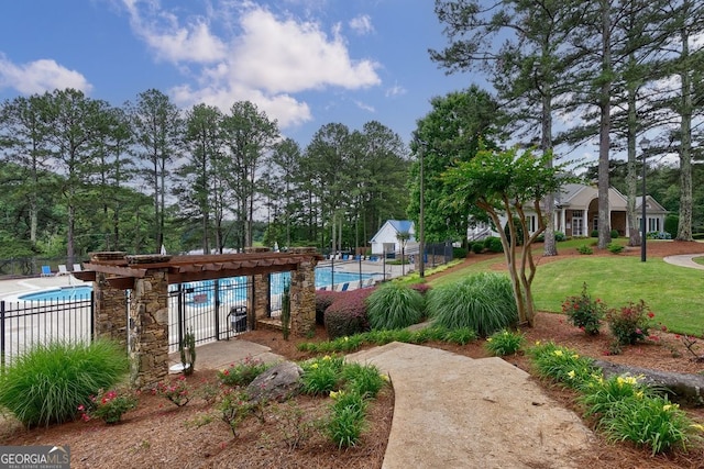 405 Woodbrook Way, Lawrenceville, GA 30043 - view of home's community featuring a swimming pool and view of wooded area
