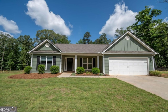 35 Westwood St, Danielsville, GA 30633 - view of front of house with board and batten siding, driveway, a garage, and a front lawn