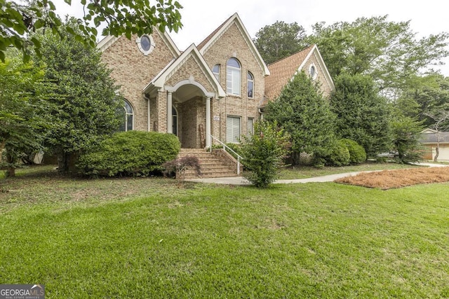 107 Julee Emilyn Dr, Bonaire, GA 31005 - traditional-style house with brick siding and a front lawn