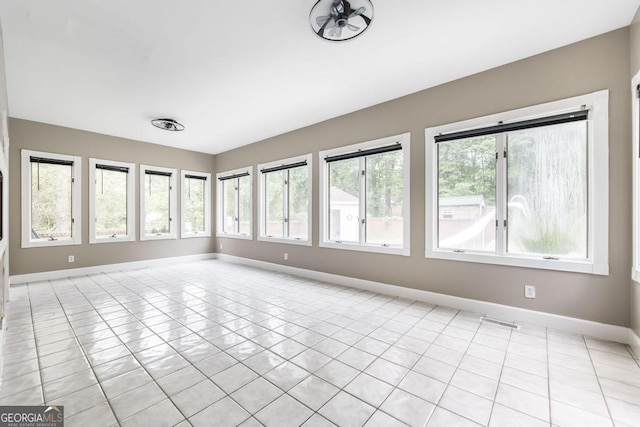 107 Julee Emilyn Dr, Bonaire, GA 31005 - unfurnished sunroom with baseboards and plenty of natural light