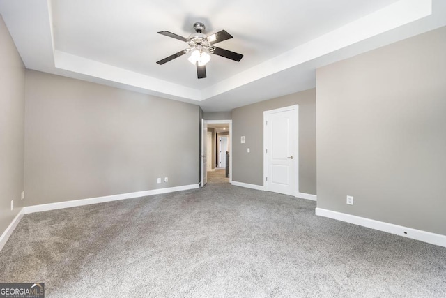 107 Julee Emilyn Dr, Bonaire, GA 31005 - unfurnished bedroom with a raised ceiling, carpet flooring, and baseboards