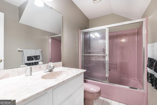 107 Julee Emilyn Dr, Bonaire, GA 31005 - full bathroom with vanity, vaulted ceiling, toilet, tile patterned flooring, and enclosed tub / shower combo