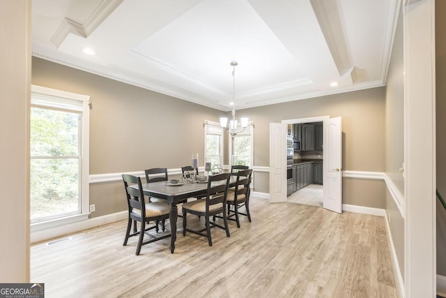 107 Julee Emilyn Dr, Bonaire, GA 31005 - dining room featuring ornamental molding, a chandelier, light wood-style floors, baseboards, and a raised ceiling