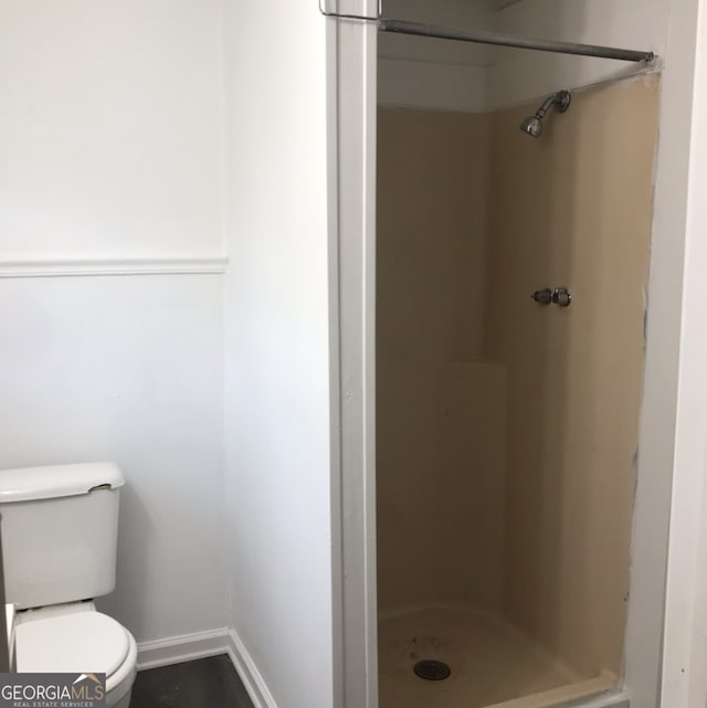 125 Jones St, Summerville, GA 30747 - bathroom featuring a shower stall, toilet, and baseboards