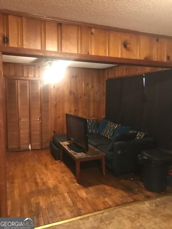 125 Jones St, Summerville, GA 30747 - living area with a textured ceiling and wooden walls