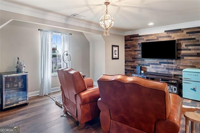 501 Rabun Ct, Canton, GA 30115 - living room with wood finished floors, baseboards, crown molding, wine cooler, and recessed lighting
