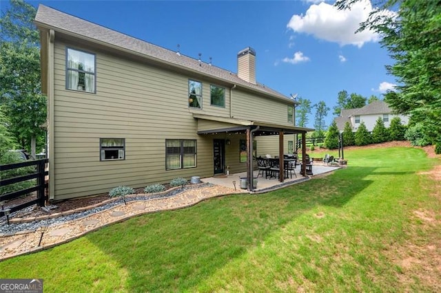 501 Rabun Ct, Canton, GA 30115 - back of property with a patio and a chimney