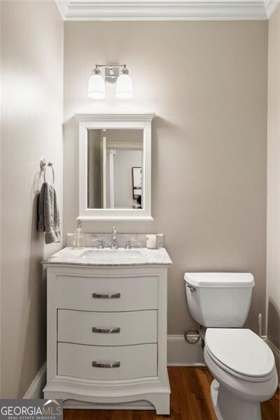 3894 Land O Lakes Dr NE, Atlanta, GA 30342 - bathroom with vanity, wood finished floors, and crown molding