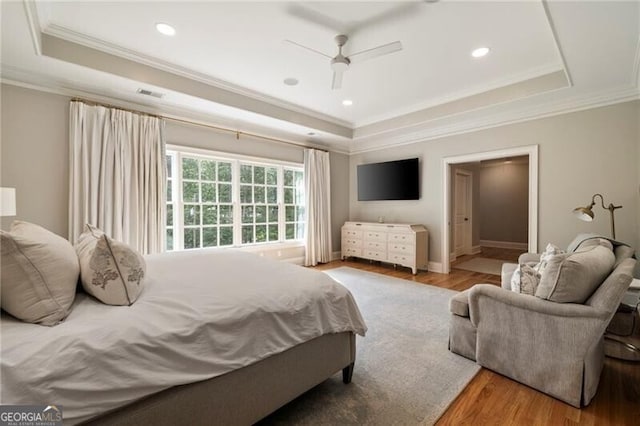 3894 Land O Lakes Dr NE, Atlanta, GA 30342 - bedroom featuring a tray ceiling, crown molding, wood finished floors, recessed lighting, and a ceiling fan