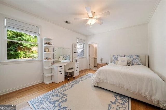 3894 Land O Lakes Dr NE, Atlanta, GA 30342 - bedroom with light wood finished floors, a desk, crown molding, and ceiling fan