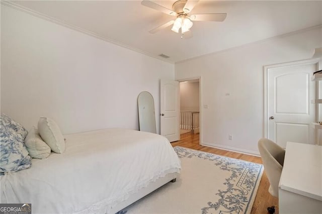 3894 Land O Lakes Dr NE, Atlanta, GA 30342 - bedroom featuring light wood finished floors, ornamental molding, and a ceiling fan
