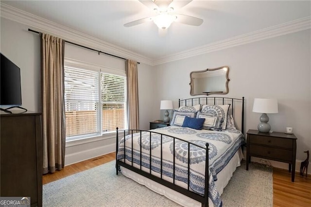 3894 Land O Lakes Dr NE, Atlanta, GA 30342 - bedroom with wood finished floors, crown molding, and ceiling fan