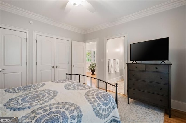 3894 Land O Lakes Dr NE, Atlanta, GA 30342 - bedroom with crown molding, wood finished floors, a ceiling fan, and a closet