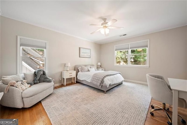 3894 Land O Lakes Dr NE, Atlanta, GA 30342 - bedroom with wood finished floors, crown molding, an office area, and ceiling fan