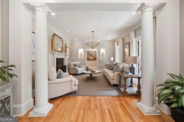 3894 Land O Lakes Dr NE, Atlanta, GA 30342 - living area with ornate columns, a fireplace, recessed lighting, ornamental molding, and light wood finished floors