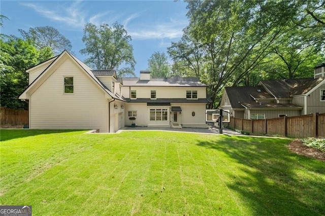 3894 Land O Lakes Dr NE, Atlanta, GA 30342 - rear view of property with a fenced backyard and a patio area